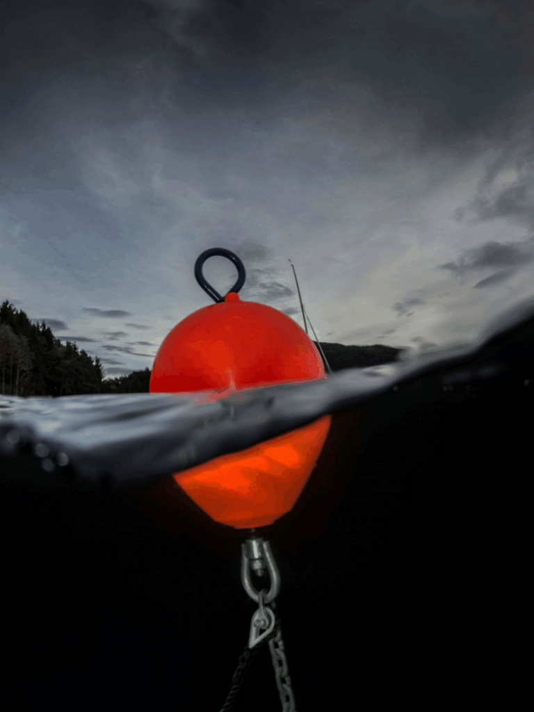 CCE red mooring buoy submerged